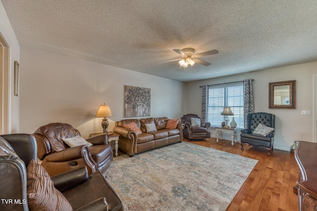 147 Rainbow Cir Unit 147, Bristol, VA 24202 - living room featuring a ceiling fan, wood finished floors, and a textured ceiling