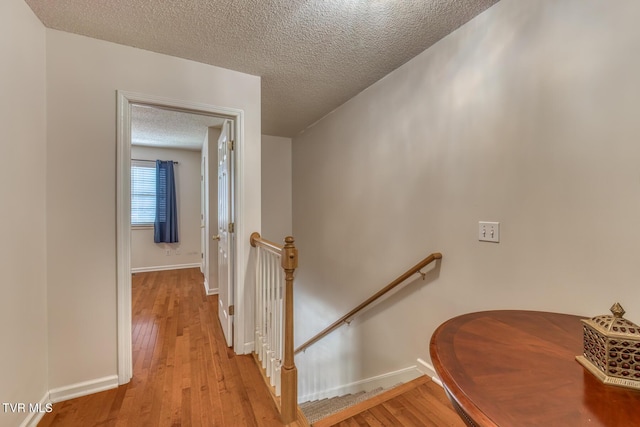 147 Rainbow Cir Unit 147, Bristol, VA 24202 - stairs featuring a textured ceiling and wood finished floors
