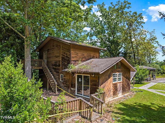 285 Vanover Ln, Jacksboro, TN 37757 - view of home's exterior with stairs, a yard, and a wooden deck