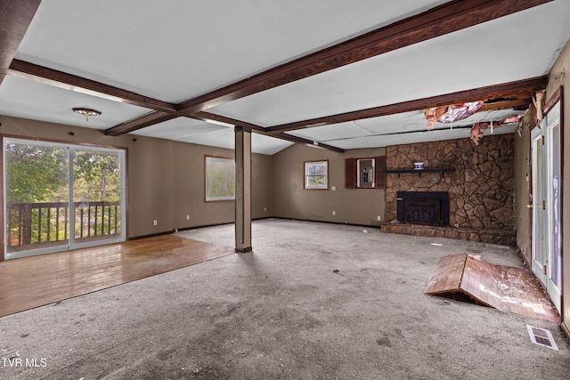 285 Vanover Ln, Jacksboro, TN 37757 - unfurnished living room featuring carpet, a fireplace, beam ceiling, and electric panel