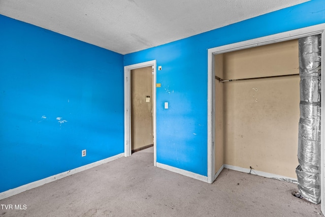 285 Vanover Ln, Jacksboro, TN 37757 - unfurnished bedroom featuring a closet, a textured ceiling, and carpet flooring