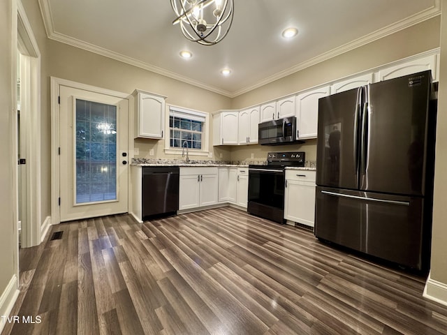 220 Cedar Creek Rd Unit 1, Johnson City, TN 37615 - kitchen featuring stainless steel appliances, white cabinets, dark wood finished floors, ornamental molding, and light stone counters