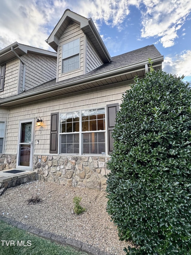 220 Cedar Creek Rd Unit 1, Johnson City, TN 37615 - view of side of home featuring stone siding and roof with shingles