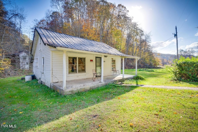 3961 Canton Rd, Blackwater, VA 24221 - view of front of property featuring a metal roof, a front lawn, and a standing seam roof