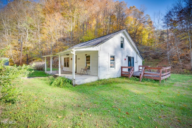 3961 Canton Rd, Blackwater, VA 24221 - view of property exterior with a yard, a view of trees, and a wooden deck