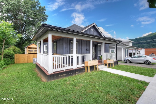 216 3rd St, Erwin, TN 37650 - bungalow-style house featuring covered porch and board and batten siding