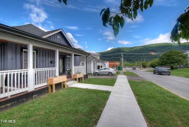 216 3rd St, Erwin, TN 37650 - view of green lawn with a porch and a mountain view