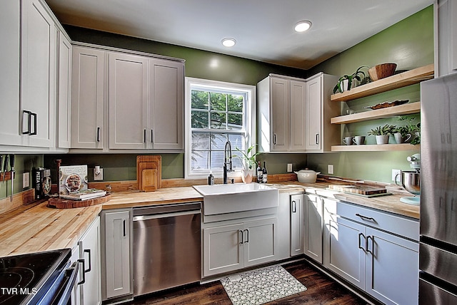 216 3rd St, Erwin, TN 37650 - kitchen featuring butcher block counters, appliances with stainless steel finishes, open shelves, dark wood finished floors, and recessed lighting