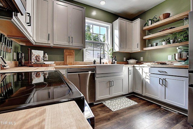216 3rd St, Erwin, TN 37650 - laundry room with dark wood-style flooring and recessed lighting