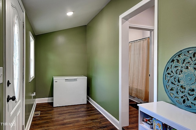 216 3rd St, Erwin, TN 37650 - laundry room with dark wood-style flooring and baseboards
