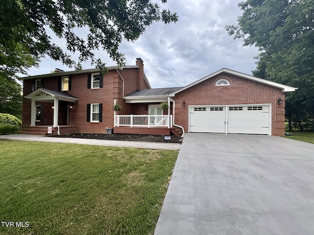 110 Galway Rd, Bristol, TN 37620 - view of front of property with a chimney, concrete driveway, brick siding, a garage, and a front lawn