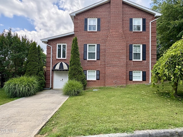 110 Galway Rd, Bristol, TN 37620 - view of front facade featuring driveway, a front yard, an attached garage, and brick siding