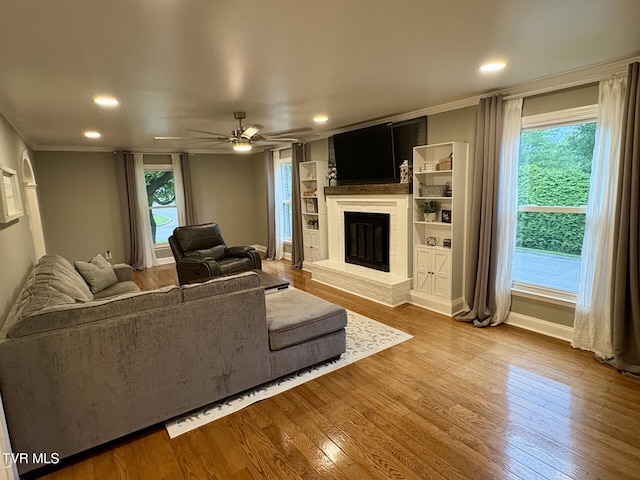 110 Galway Rd, Bristol, TN 37620 - living room with crown molding, wood finished floors, a fireplace, ceiling fan, and recessed lighting