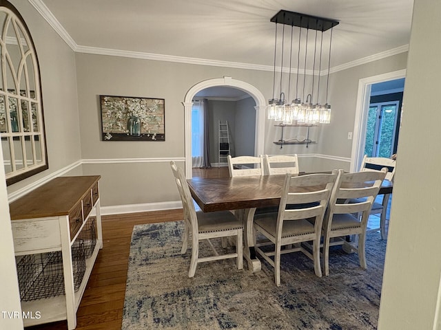 110 Galway Rd, Bristol, TN 37620 - dining room featuring crown molding, wood finished floors, and arched walkways