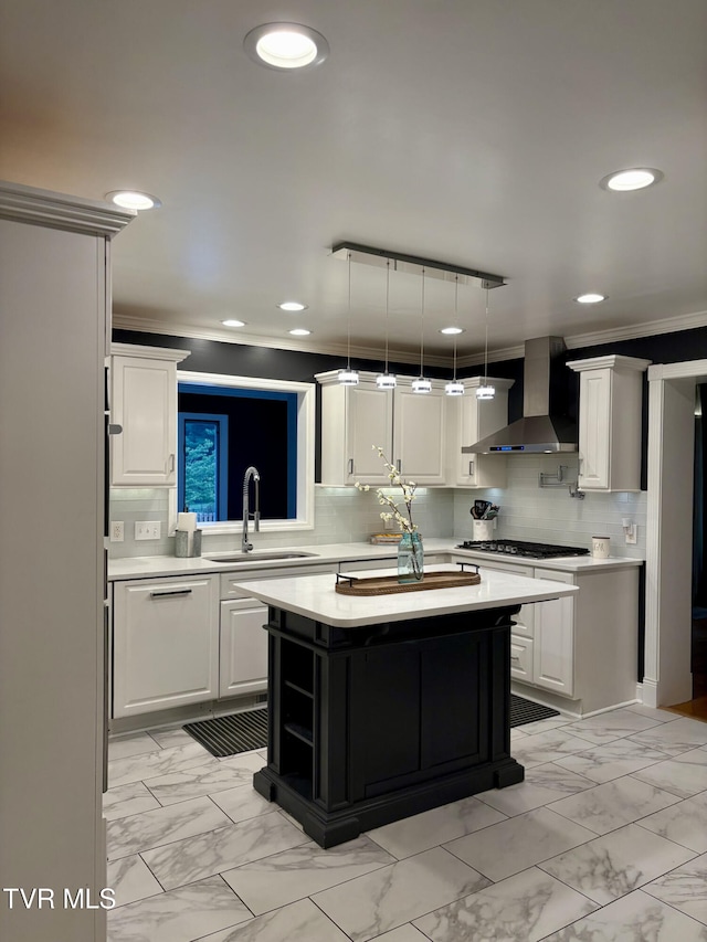 110 Galway Rd, Bristol, TN 37620 - kitchen featuring wall chimney exhaust hood, light countertops, a kitchen island, crown molding, and white cabinets