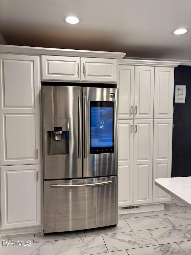 110 Galway Rd, Bristol, TN 37620 - kitchen featuring stainless steel fridge, white cabinetry, light marble finish flooring, and recessed lighting