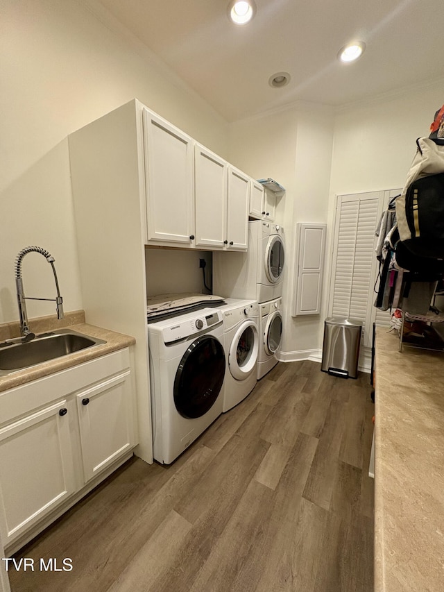 110 Galway Rd, Bristol, TN 37620 - laundry room featuring cabinet space, estacked washer and dryer, washer and clothes dryer, dark wood-style flooring, and recessed lighting