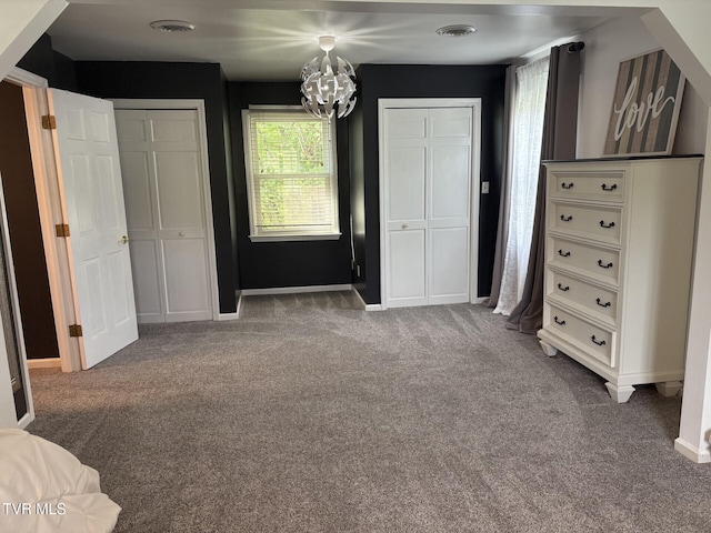 110 Galway Rd, Bristol, TN 37620 - unfurnished bedroom with two closets, carpet floors, and a chandelier