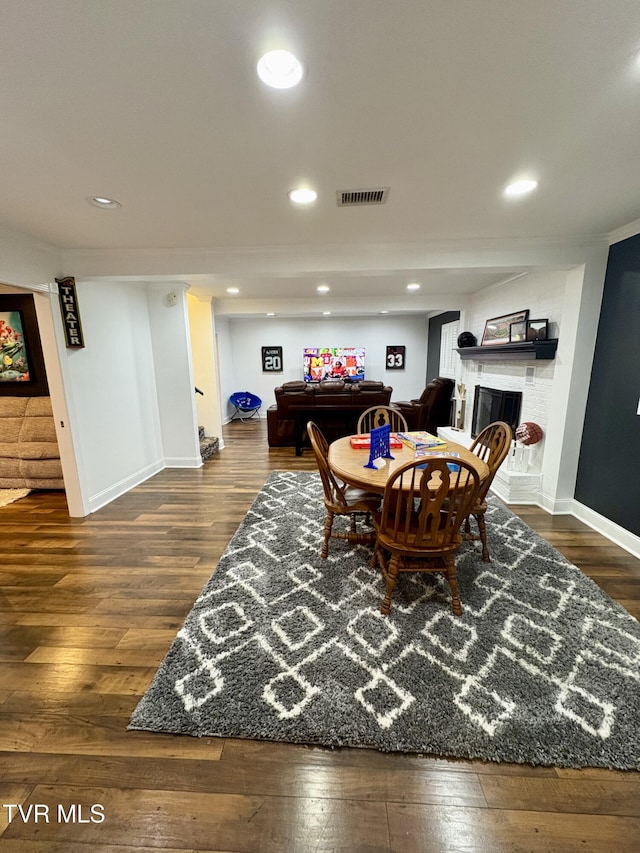 110 Galway Rd, Bristol, TN 37620 - dining area featuring dark wood-type flooring, a fireplace, recessed lighting, and crown molding