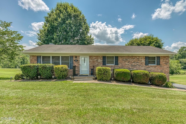 409 Brooklea Cir, Bluff City, TN 37618 - single story home with a front yard, brick siding, and a shingled roof