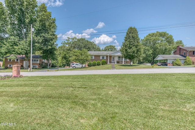 409 Brooklea Cir, Bluff City, TN 37618 - view of front facade featuring a front yard and concrete driveway