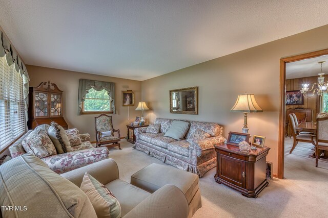 409 Brooklea Cir, Bluff City, TN 37618 - living room with light carpet and a chandelier