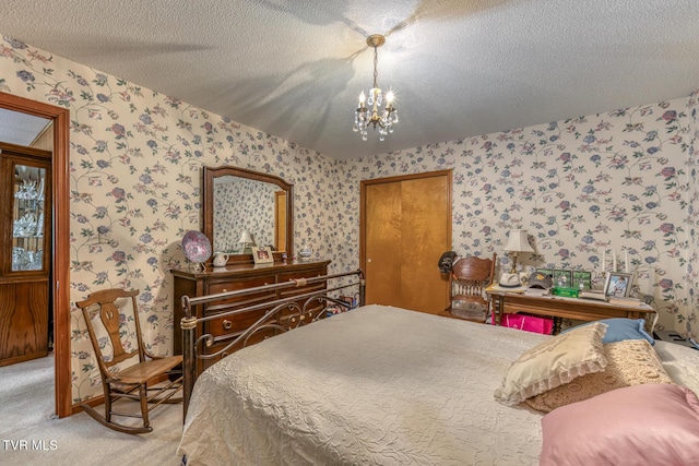 409 Brooklea Cir, Bluff City, TN 37618 - bedroom with wallpapered walls, light colored carpet, a chandelier, and a textured ceiling