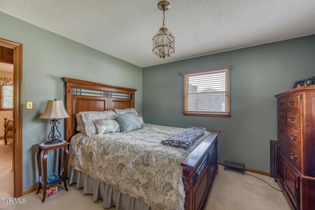 409 Brooklea Cir, Bluff City, TN 37618 - bedroom with light carpet and a textured ceiling