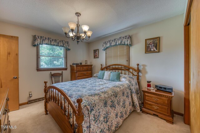 409 Brooklea Cir, Bluff City, TN 37618 - bedroom featuring light carpet, a chandelier, and a textured ceiling