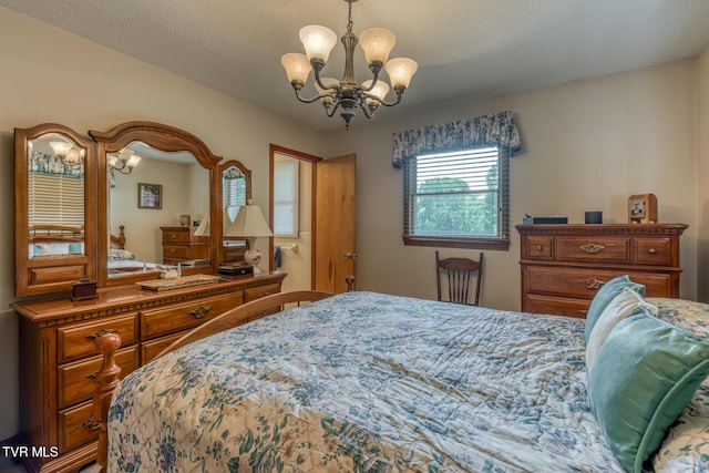 409 Brooklea Cir, Bluff City, TN 37618 - bedroom with a chandelier