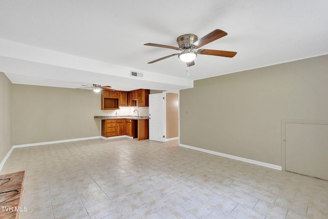 308 Cardinal Ln, Bristol, TN 37620 - unfurnished living room featuring ceiling fan and a sink