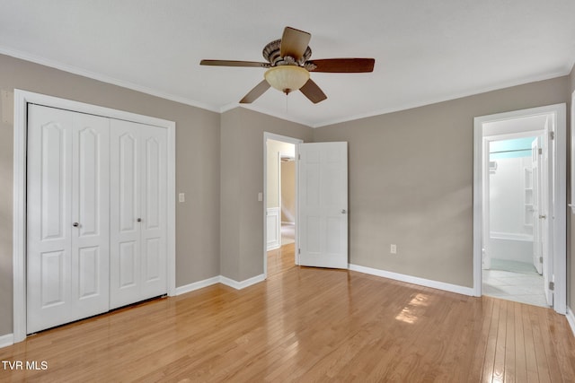 308 Cardinal Ln, Bristol, TN 37620 - unfurnished bedroom featuring light wood-style floors, a closet, ornamental molding, a ceiling fan, and ensuite bath