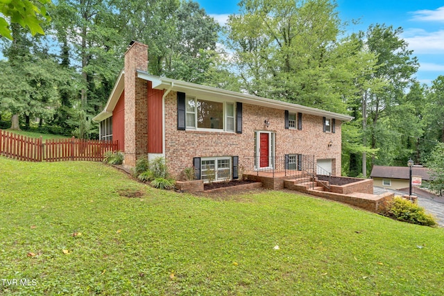 308 Cardinal Ln, Bristol, TN 37620 - view of front of house featuring a chimney, an attached garage, brick siding, and driveway