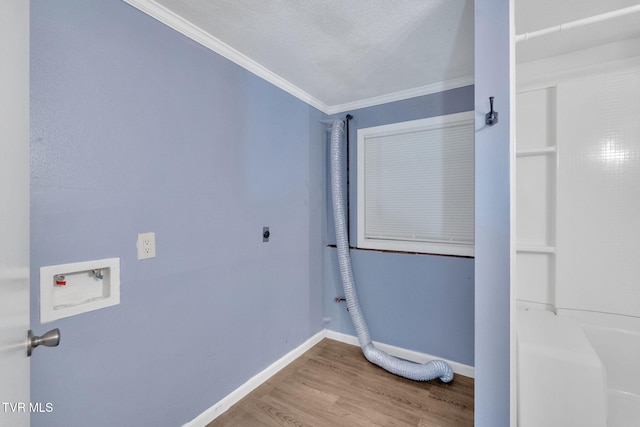 308 Cardinal Ln, Bristol, TN 37620 - laundry room featuring hookup for an electric dryer, hookup for a washing machine, ornamental molding, and wood finished floors