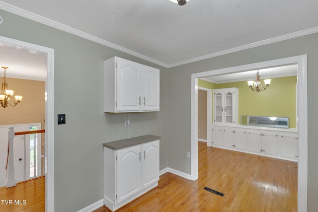 308 Cardinal Ln, Bristol, TN 37620 - hall with a chandelier, light wood-type flooring, and ornamental molding