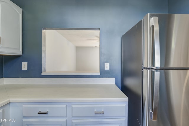 152 Gray Station Rd Unit 35, Gray, TN 37615 - kitchen with freestanding refrigerator, light countertops, and white cabinetry