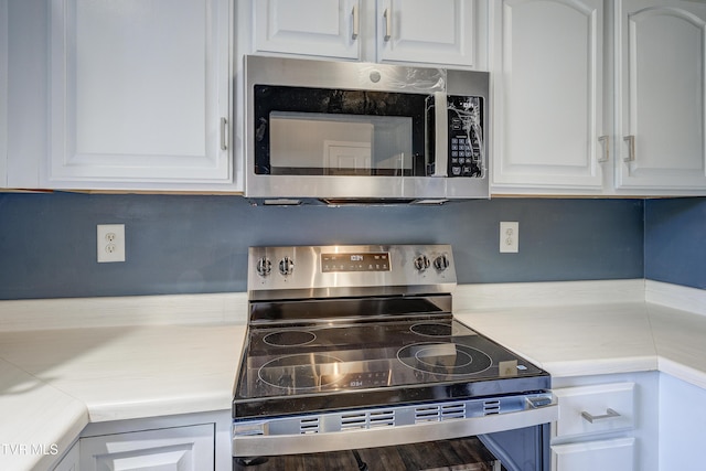 152 Gray Station Rd Unit 35, Gray, TN 37615 - kitchen with appliances with stainless steel finishes, light countertops, and white cabinetry