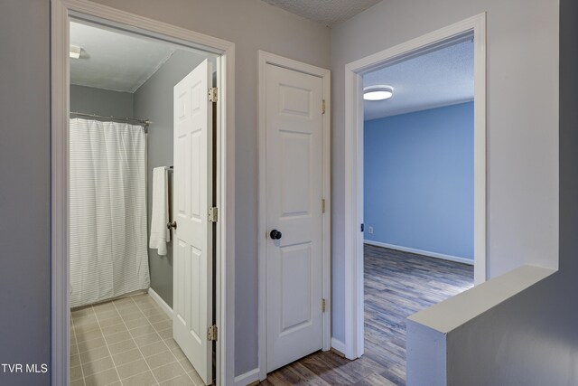 152 Gray Station Rd Unit 35, Gray, TN 37615 - hallway with a textured ceiling and wood finished floors