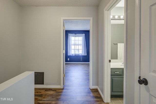 152 Gray Station Rd Unit 35, Gray, TN 37615 - corridor with wood finished floors and a textured ceiling