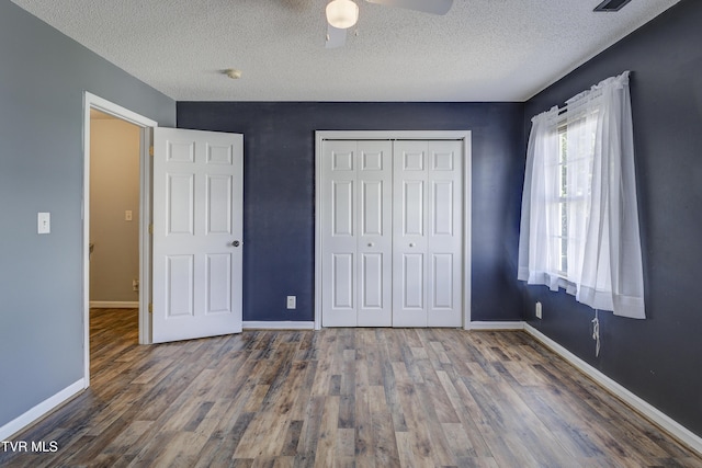 152 Gray Station Rd Unit 35, Gray, TN 37615 - unfurnished bedroom with a textured ceiling, wood finished floors, a closet, and ceiling fan