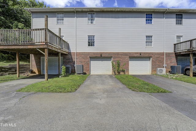 152 Gray Station Rd Unit 35, Gray, TN 37615 - back of property with an attached garage, driveway, brick siding, and a deck