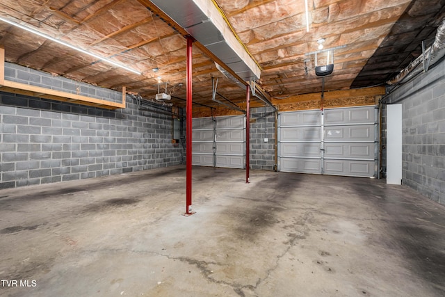 216 Mockingbird Pl, Jonesborough, TN 37659 - garage featuring a garage door opener and concrete block wall