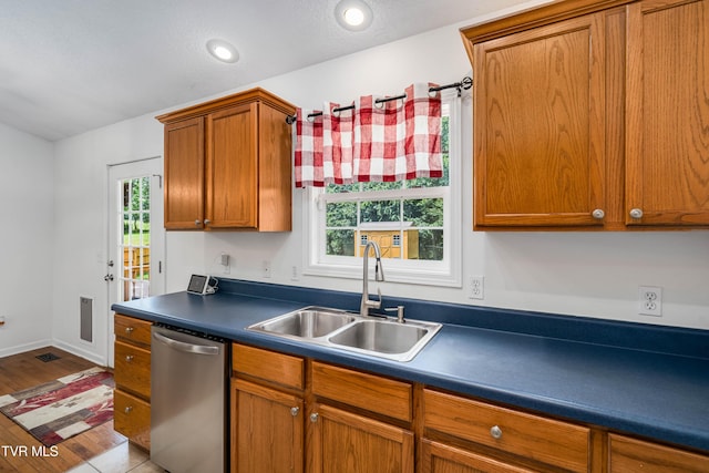 216 Mockingbird Pl, Jonesborough, TN 37659 - kitchen with stainless steel dishwasher, brown cabinets, dark countertops, wood finished floors, and recessed lighting