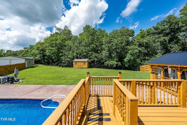 216 Mockingbird Pl, Jonesborough, TN 37659 - deck featuring a storage shed, an outdoor pool, view of scattered trees, and a patio
