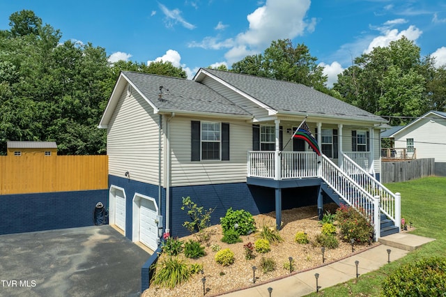 216 Mockingbird Pl, Jonesborough, TN 37659 - view of front facade featuring a porch, an attached garage, asphalt driveway, a shingled roof, and stairway