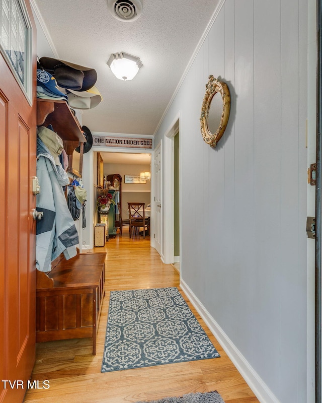 312 Timberlane Rd, Bristol, TN 37620 - entryway with crown molding, wood finished floors, and a textured ceiling