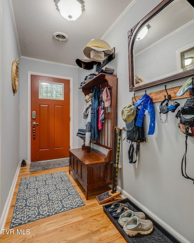 312 Timberlane Rd, Bristol, TN 37620 - mudroom with light wood finished floors, a textured ceiling, and ornamental molding