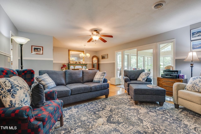312 Timberlane Rd, Bristol, TN 37620 - living area with ceiling fan, wood finished floors, and a chandelier