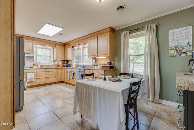 312 Timberlane Rd, Bristol, TN 37620 - kitchen with plenty of natural light, backsplash, ornamental molding, light brown cabinets, and appliances with stainless steel finishes
