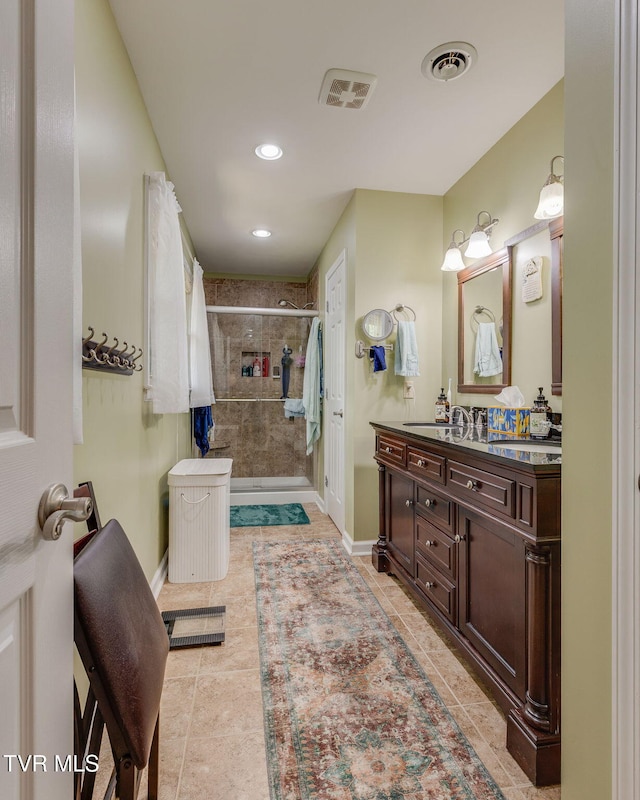 312 Timberlane Rd, Bristol, TN 37620 - full bath with double vanity, a tile shower, tile patterned floors, and recessed lighting